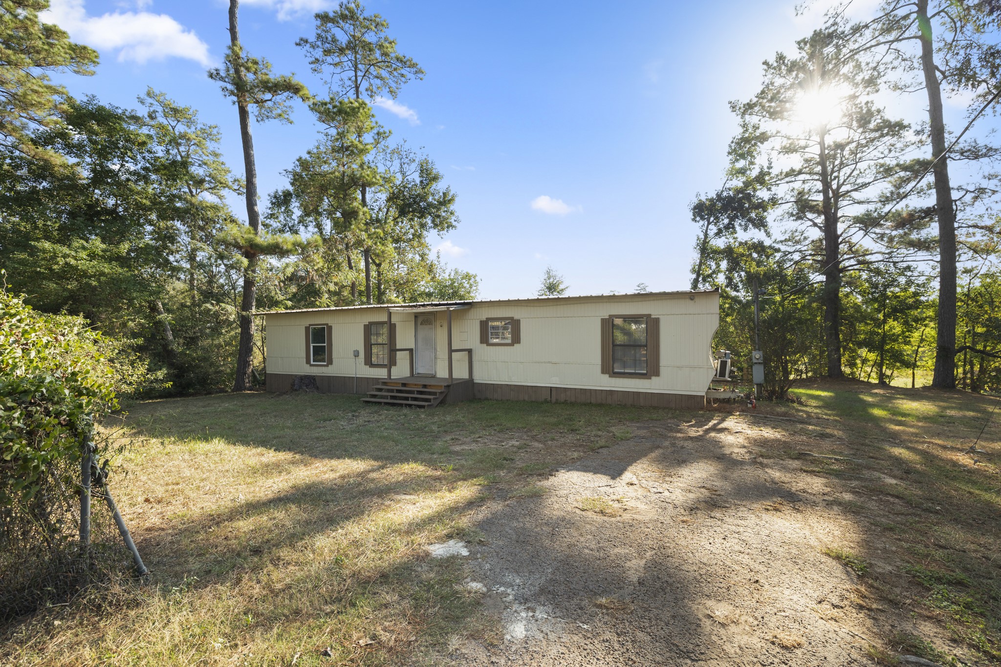 37111 Middle Trail Magnolia, TX 77354 - Photo 33 of 36 a view of a yard with a house and a large tree