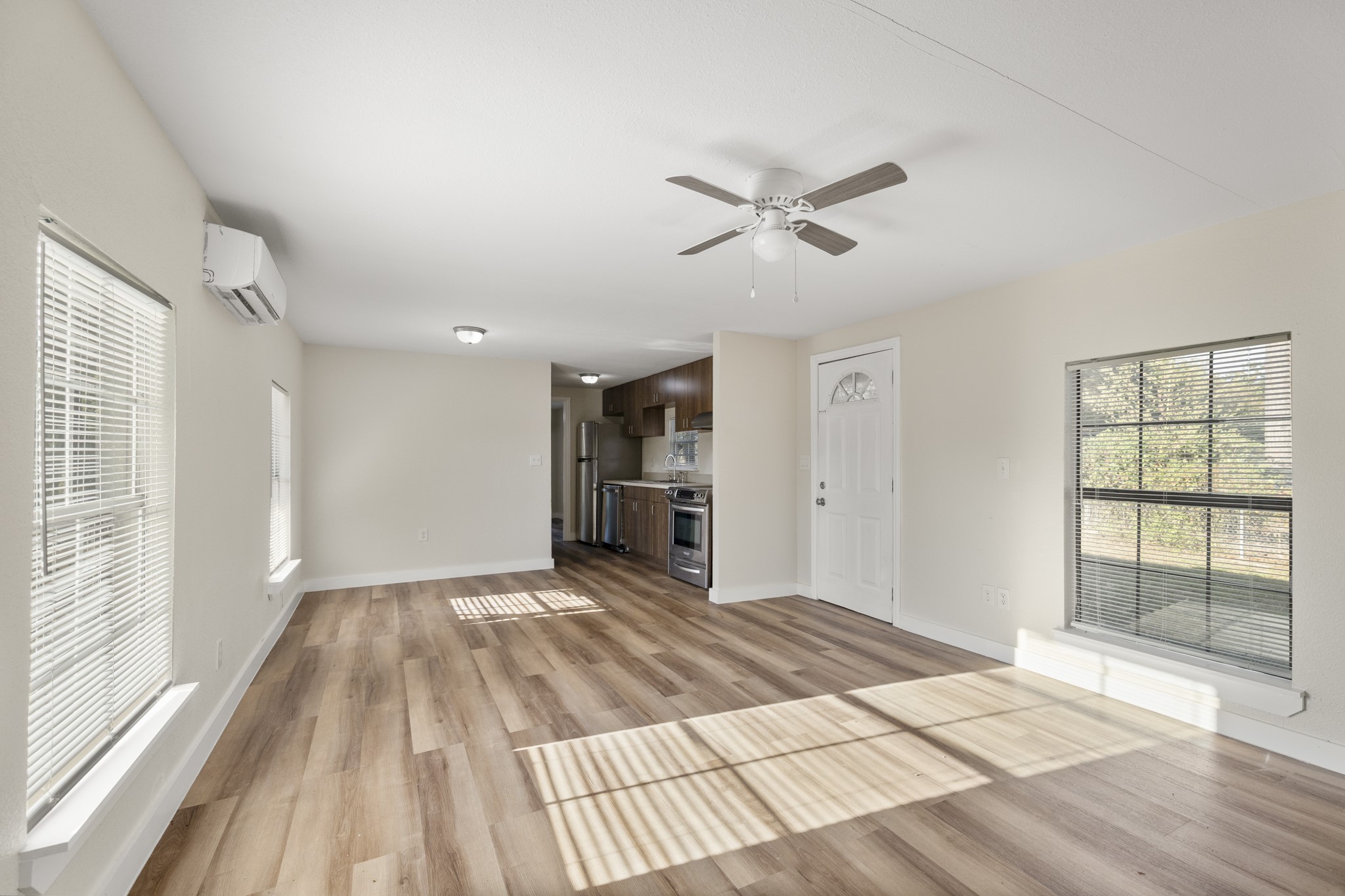 37111 Middle Trail Magnolia, TX 77354 - Photo 8 of 36 a view of empty room with wooden floor and fan