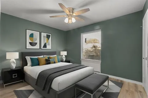 a bedroom with a large bed and a window