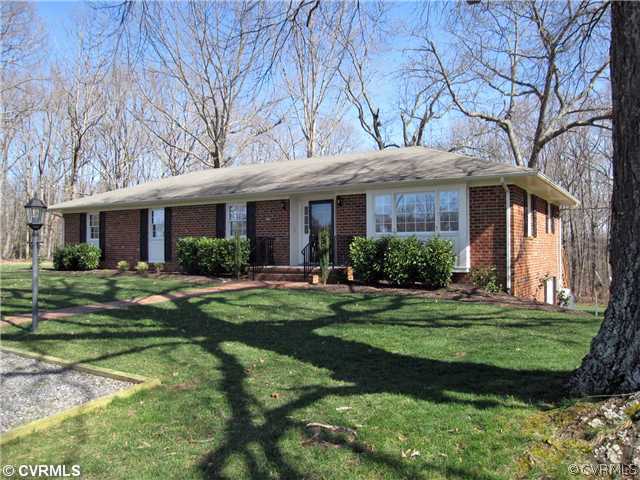 2590 Broadstreet Road Gum Spring, VA 23065 - Photo 1 of 9 a front view of a house with a garden