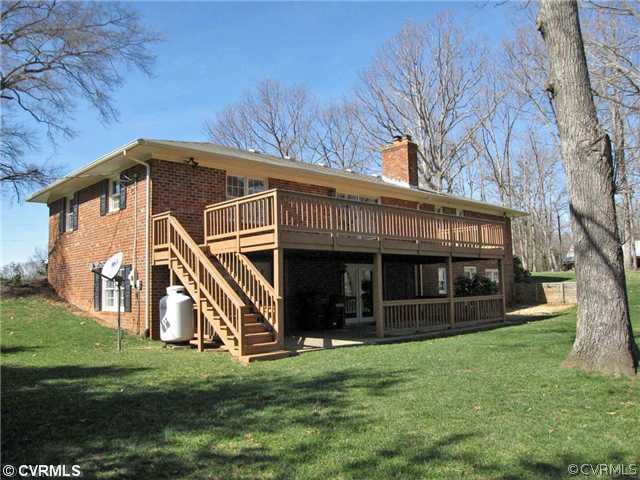 2590 Broadstreet Road Gum Spring, VA 23065 - Photo 4 of 9 a view of a house with a yard and a large tree