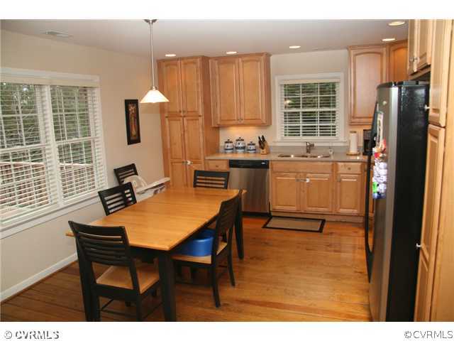2590 Broadstreet Road Gum Spring, VA 23065 - Photo 5 of 9 a kitchen with a table chairs refrigerator and cabinets