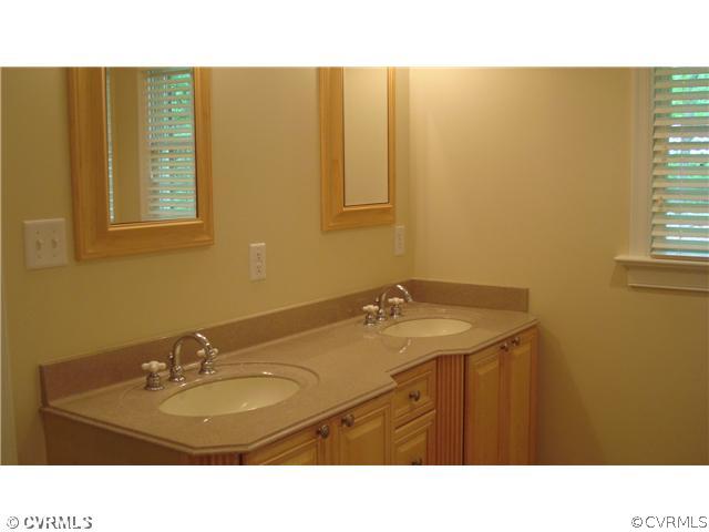 2590 Broadstreet Road Gum Spring, VA 23065 - Photo 7 of 9 a bathroom with a sink and a mirror