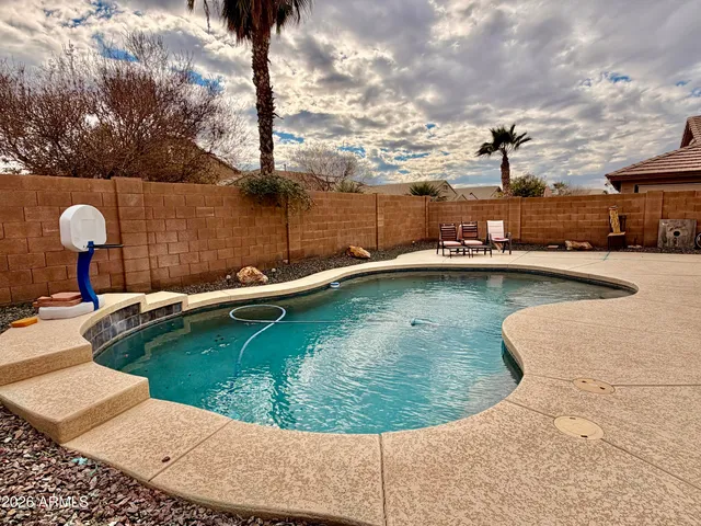 a view of a swimming pool with a lake view