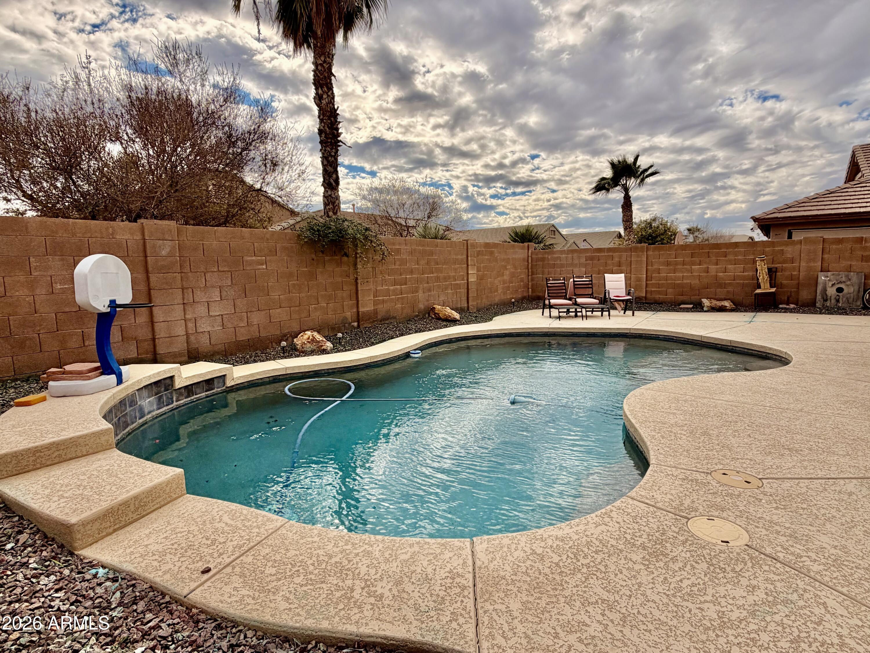 42645 West Venture Road Maricopa, AZ 85138 - Photo 15 of 37 a view of a swimming pool with a lake view