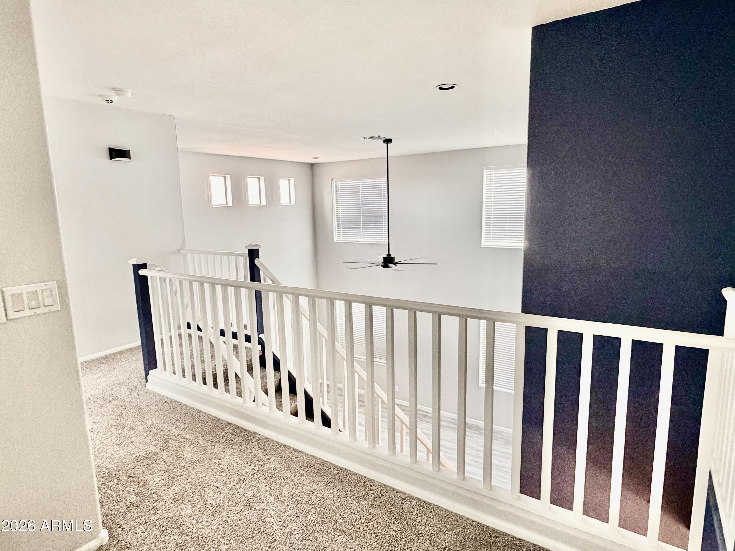 42645 West Venture Road Maricopa, AZ 85138 - Photo 16 of 37 a view of a hallway with windows