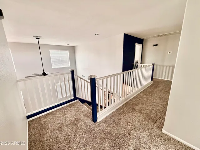 a view of a hallway with windows