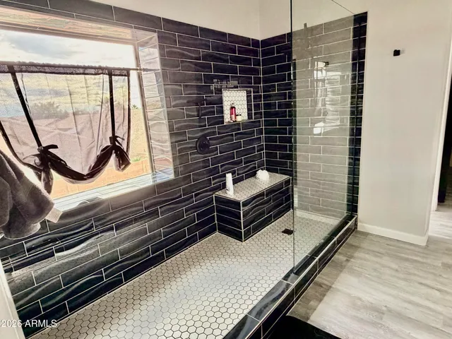 a view of a living room and wooden floor