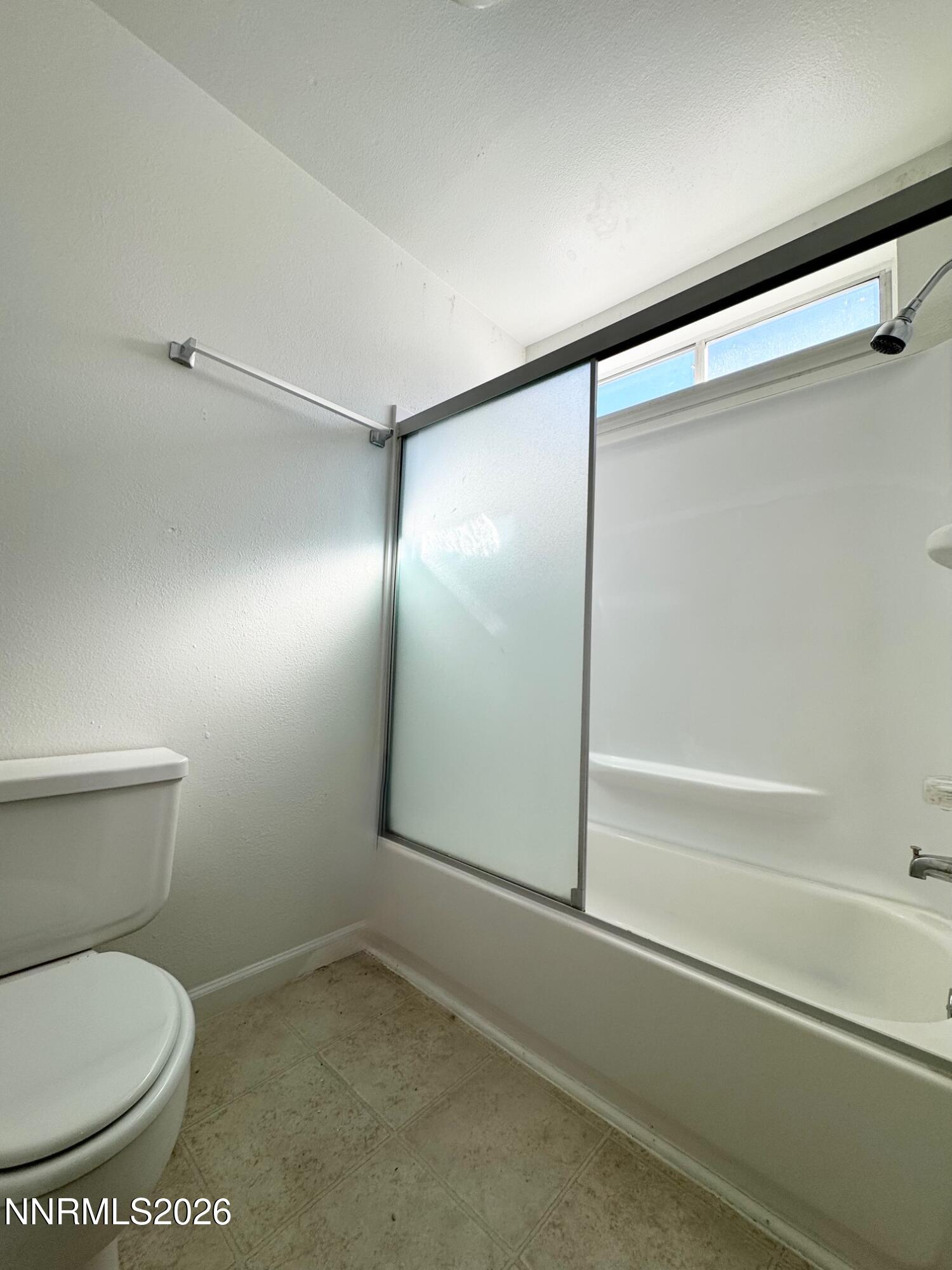 7541 Lighthouse Lane Reno, NV 89511 - Photo 19 of 24 a bathroom with a toilet and a shower