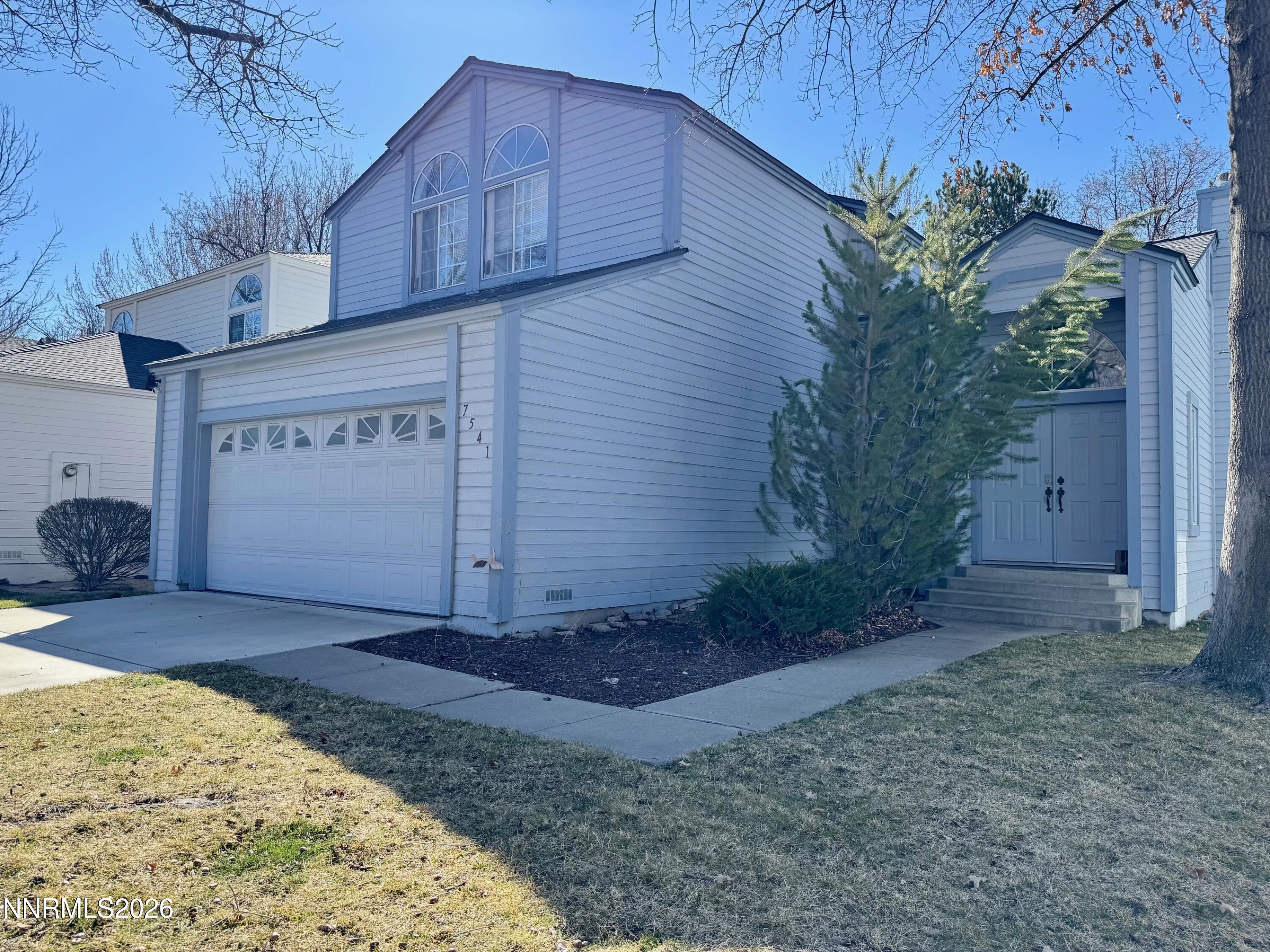 7541 Lighthouse Lane Reno, NV 89511 - Photo 2 of 24 a view of a house with a small yard