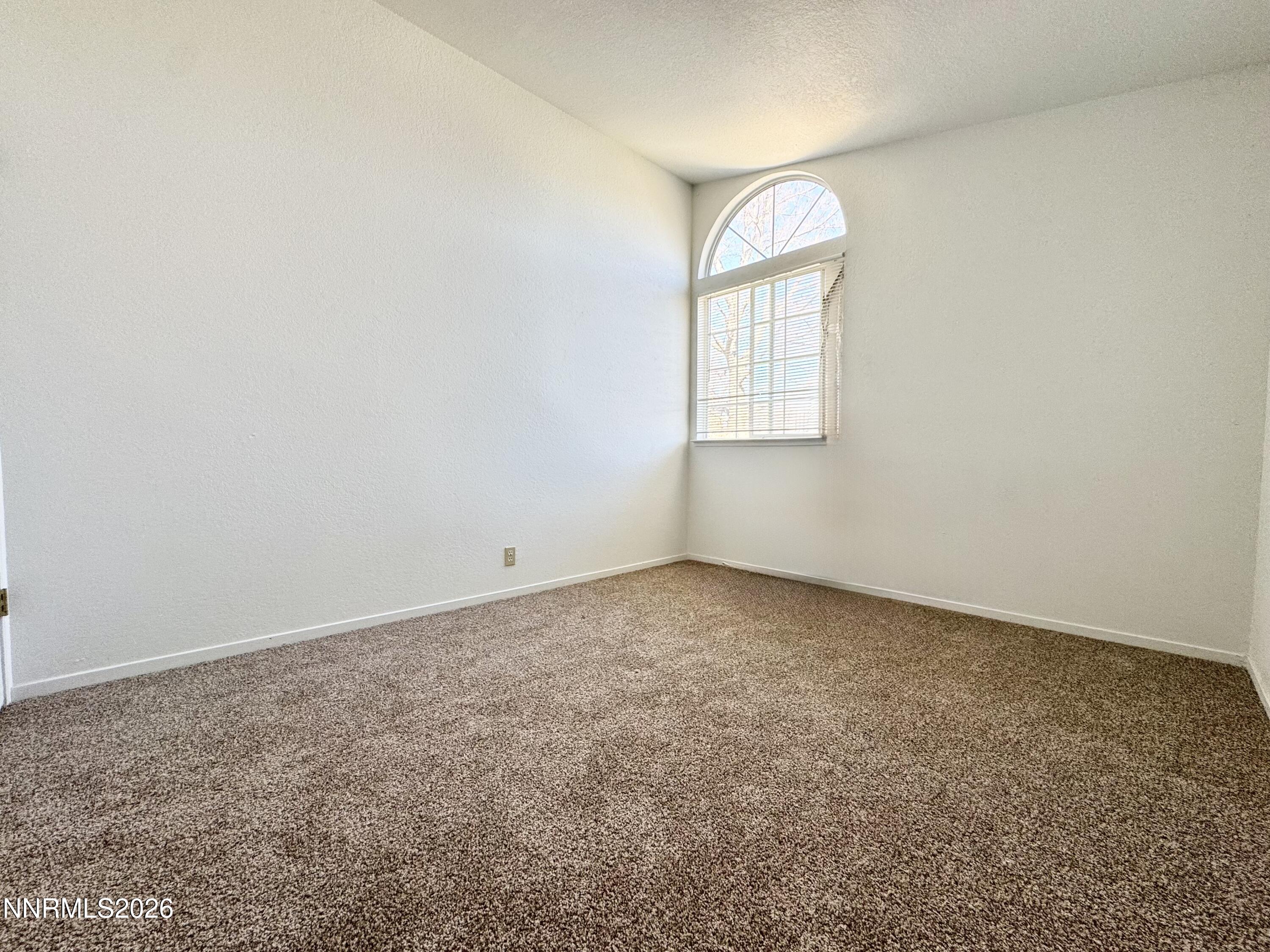 7541 Lighthouse Lane Reno, NV 89511 - Photo 21 of 24 an empty room with a window
