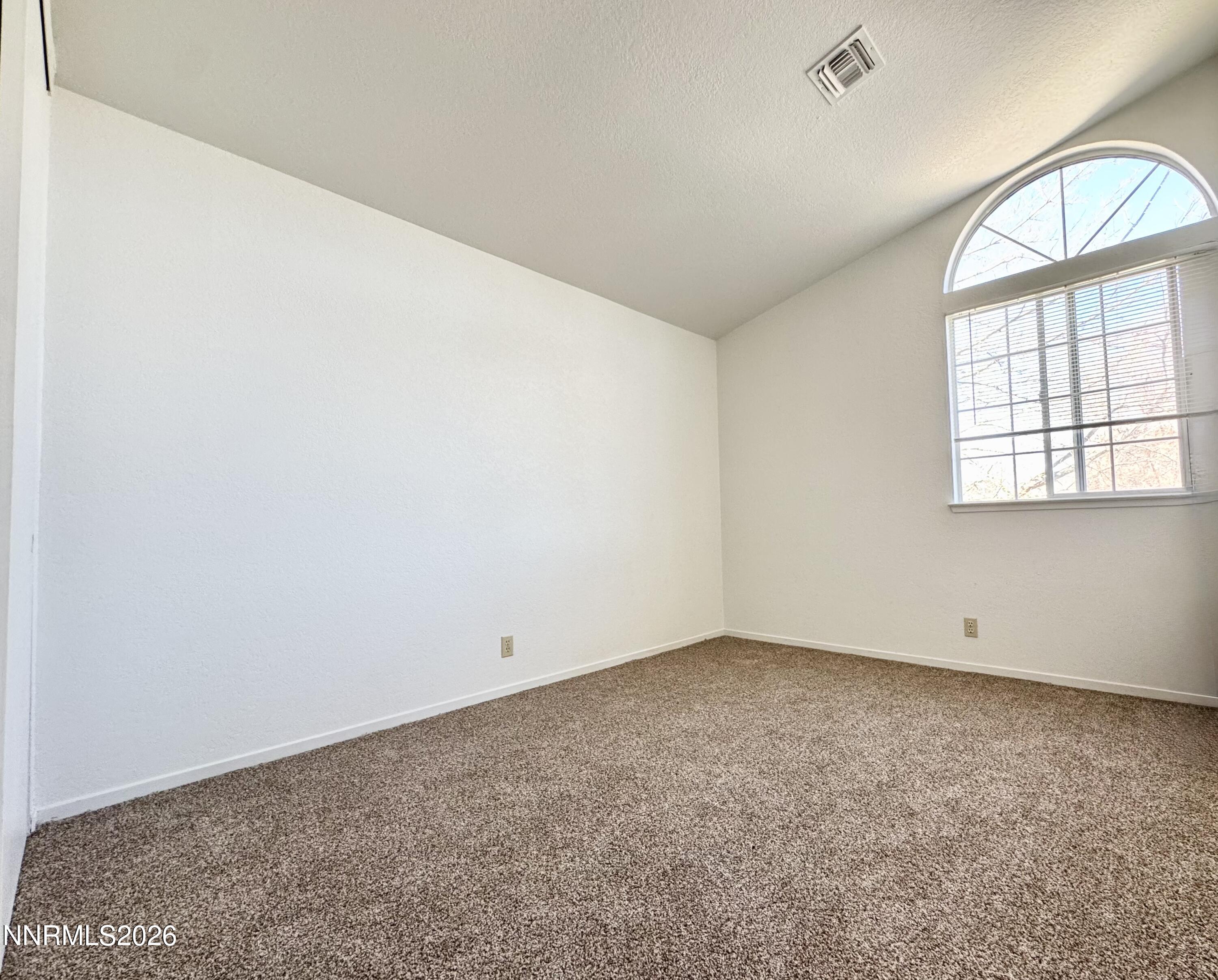 7541 Lighthouse Lane Reno, NV 89511 - Photo 22 of 24 an empty room with a window