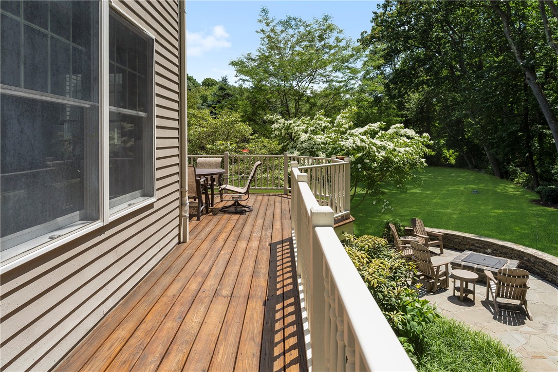 8 Howland Farm Road East Greenwich, RI 02818 - Photo 35 of 42 The deck wraps around the back of the house. View of the patio and fire-pit below