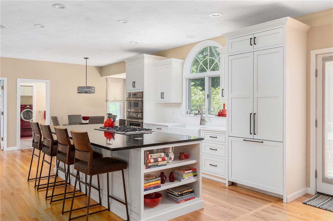 8 Howland Farm Road East Greenwich, RI 02818 - Photo 7 of 42 Newly renovated eat-in-kitchen with granite counters and silestone island with seating