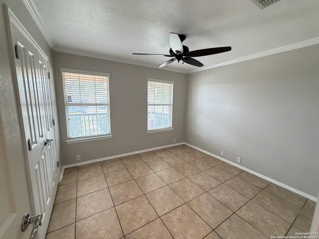 a view of an empty room and a window