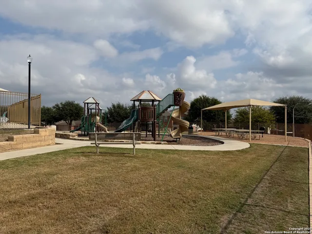an outdoor space with patio and barbeque oven