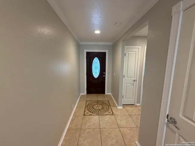 a view of a bathroom with a sink and a mirror