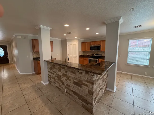 a view of a kitchen with a sink cabinet and a living room