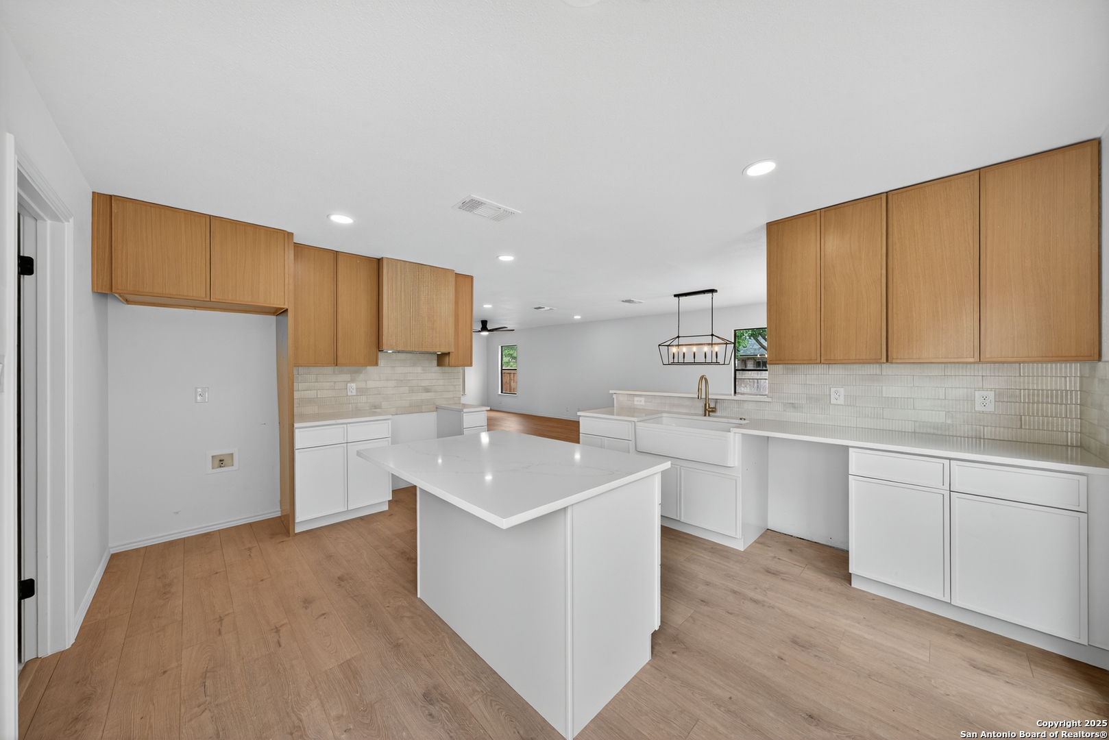 12110 Branding Point Helotes, TX 78023 - Photo 13 of 40 a kitchen with stainless steel appliances a sink stove and cabinets