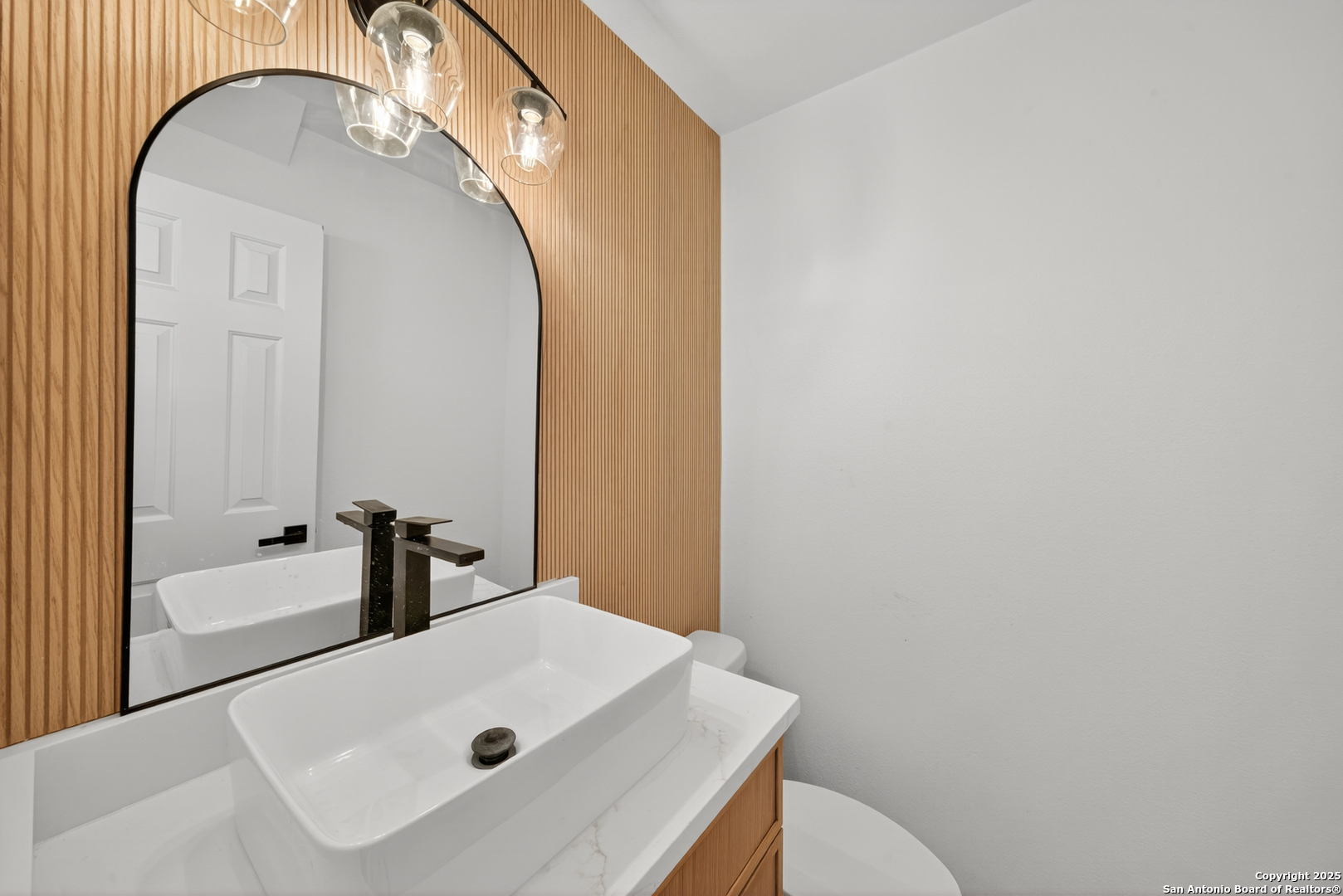 12110 Branding Point Helotes, TX 78023 - Photo 18 of 40 a bathroom with a sink and a mirror