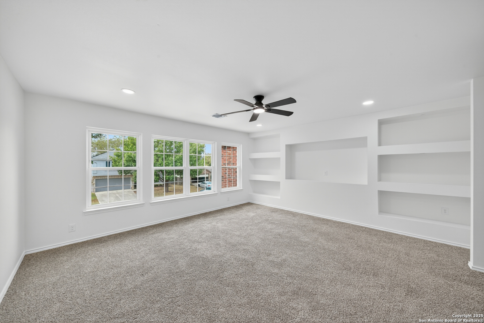 12110 Branding Point Helotes, TX 78023 - Photo 19 of 40 a view of an empty room with a window and cabinet