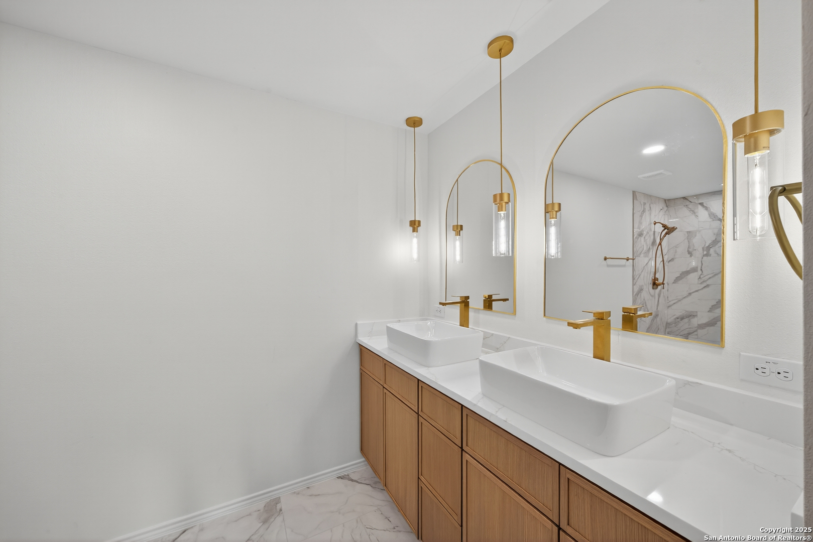12110 Branding Point Helotes, TX 78023 - Photo 22 of 40 a bathroom with a sink and a mirror