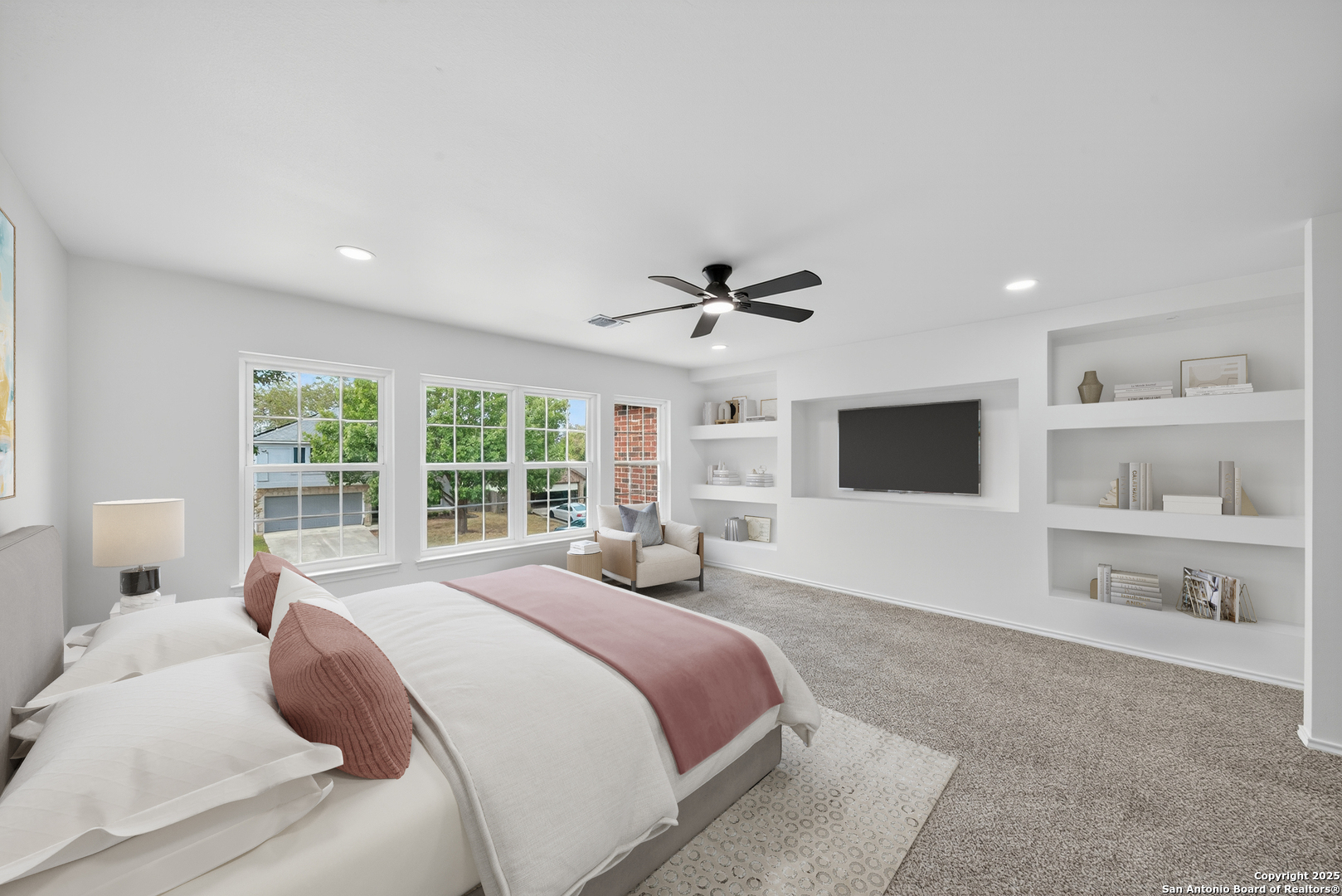 12110 Branding Point Helotes, TX 78023 - Photo 3 of 40 a bedroom with a large bed and a window