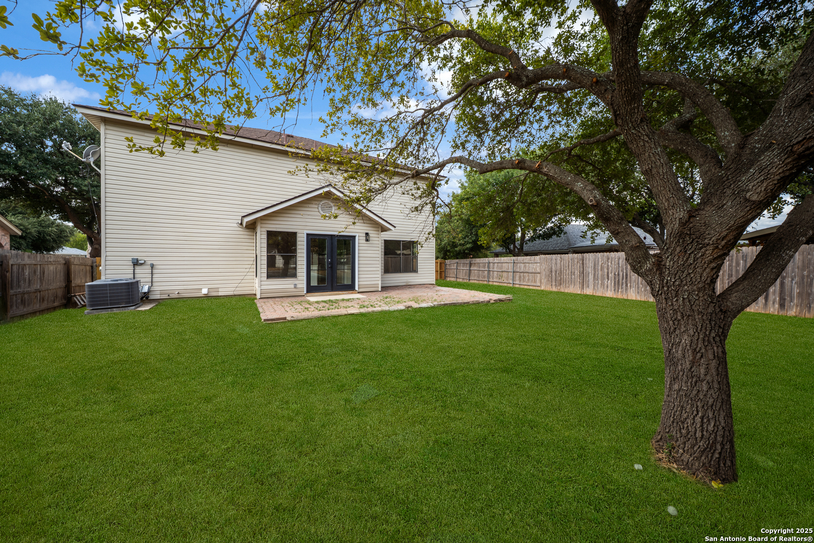 12110 Branding Point Helotes, TX 78023 - Photo 32 of 40 a front view of house with a garden