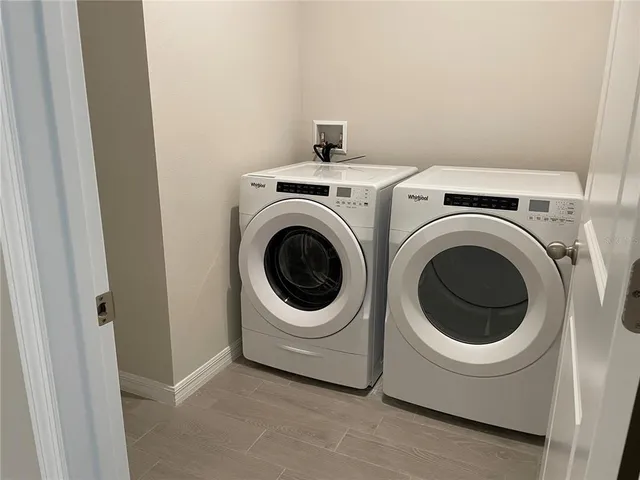 a utility room with dryer and washer