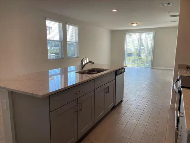 a kitchen with a sink and cabinets