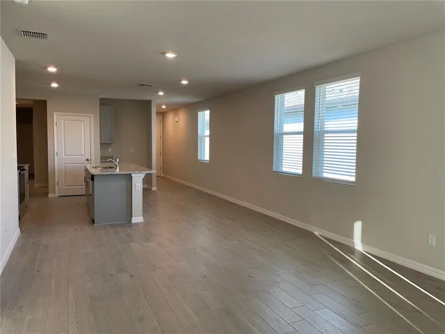 a view of a livingroom with furniture and window