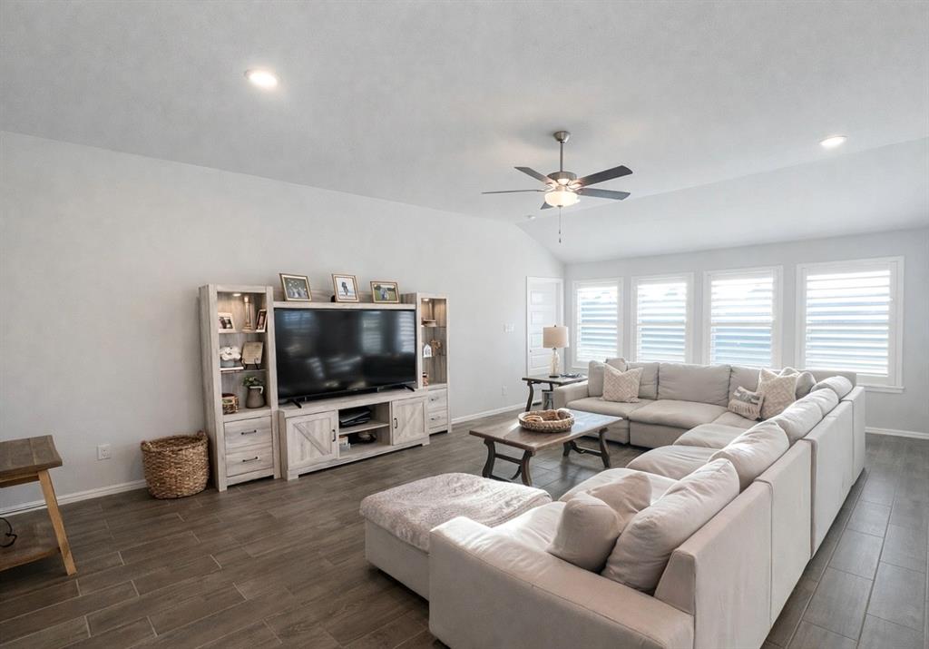 6609 Adderly Road Pilot Point, TX 76258 - Photo 2 of 15 a living room with furniture and a flat screen tv
