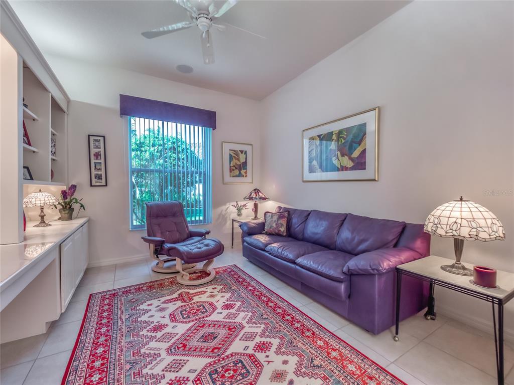 6631 Waters Edge Way Lakewood Ranch, FL 34202 - Photo 59 of 78 a living room with furniture or couch and a window