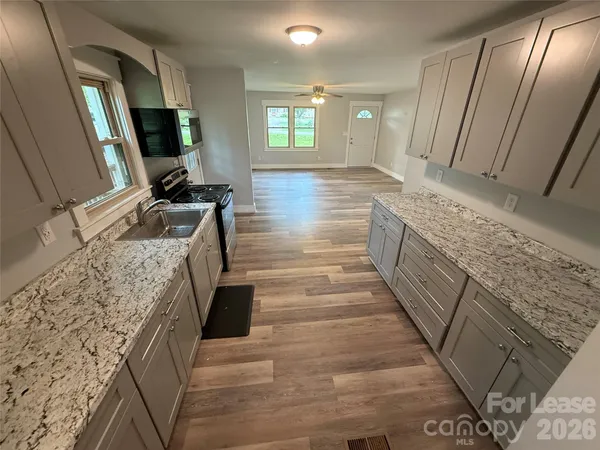 a bathroom with sink and mirror