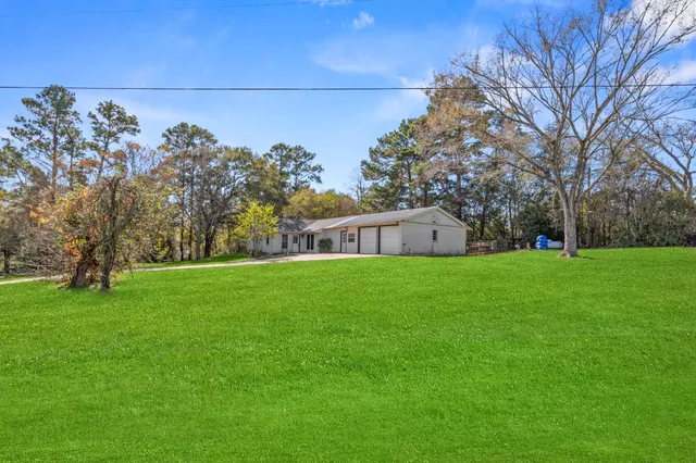 a view of a house with a back yard