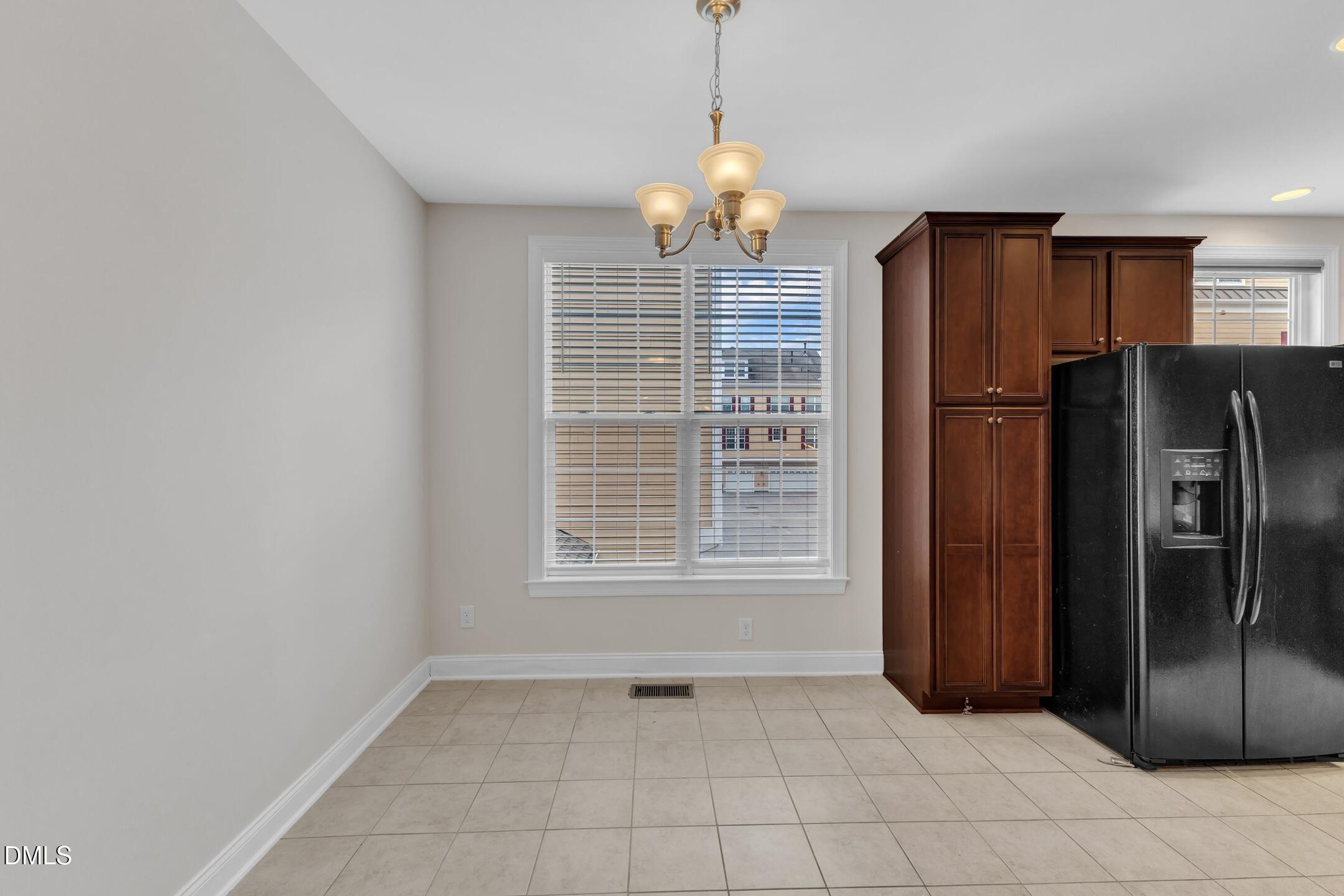9211 Calabria Drive, Unit 104 Raleigh, NC 27617 - Photo 18 of 45 a view of kitchen with refrigerator cabinets and furniture