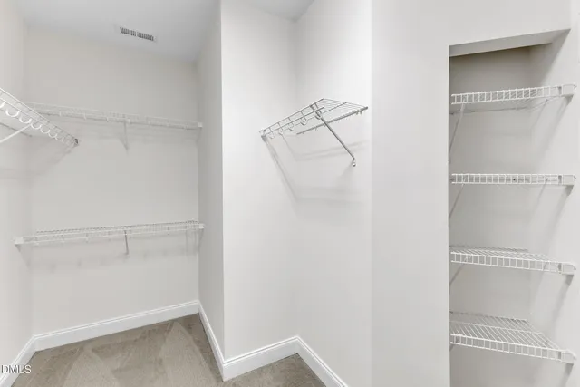 a view of an empty walk in closet
