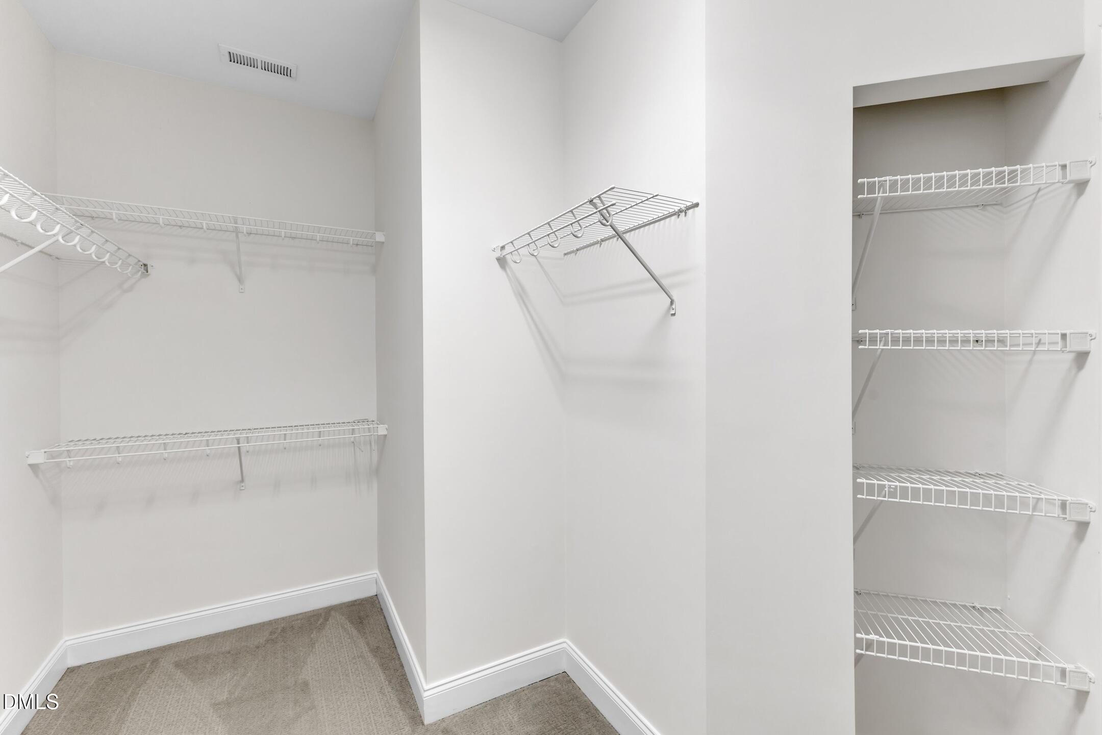 9211 Calabria Drive, Unit 104 Raleigh, NC 27617 - Photo 26 of 45 a view of an empty walk in closet