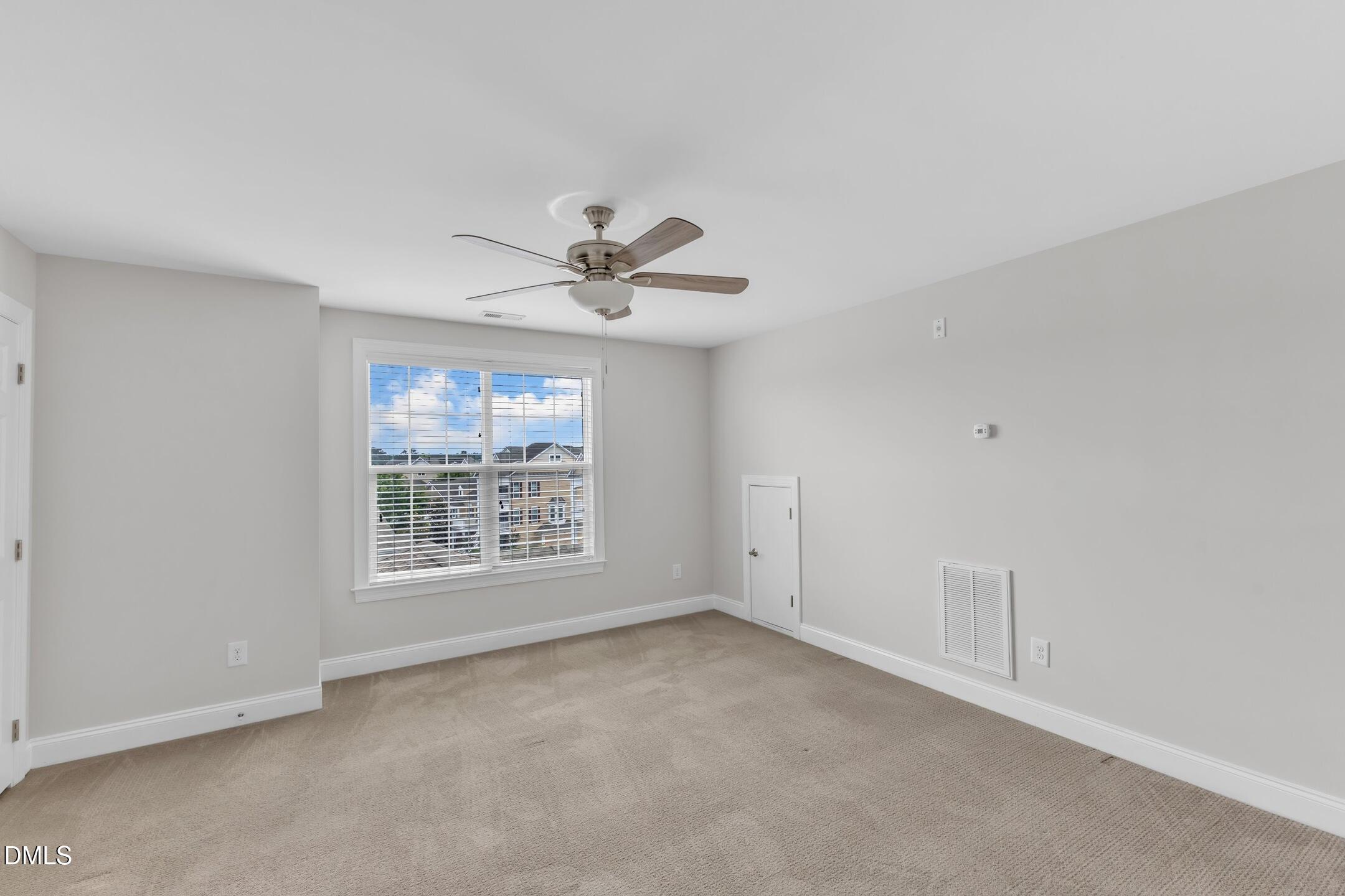 9211 Calabria Drive, Unit 104 Raleigh, NC 27617 - Photo 29 of 45 a view of an empty room with a window