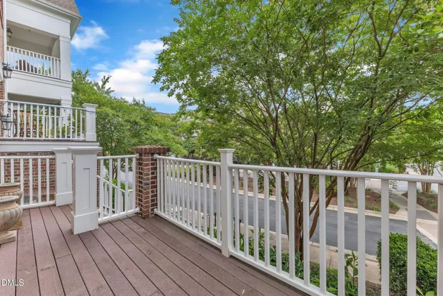 a view of deck with wooden floor and fence
