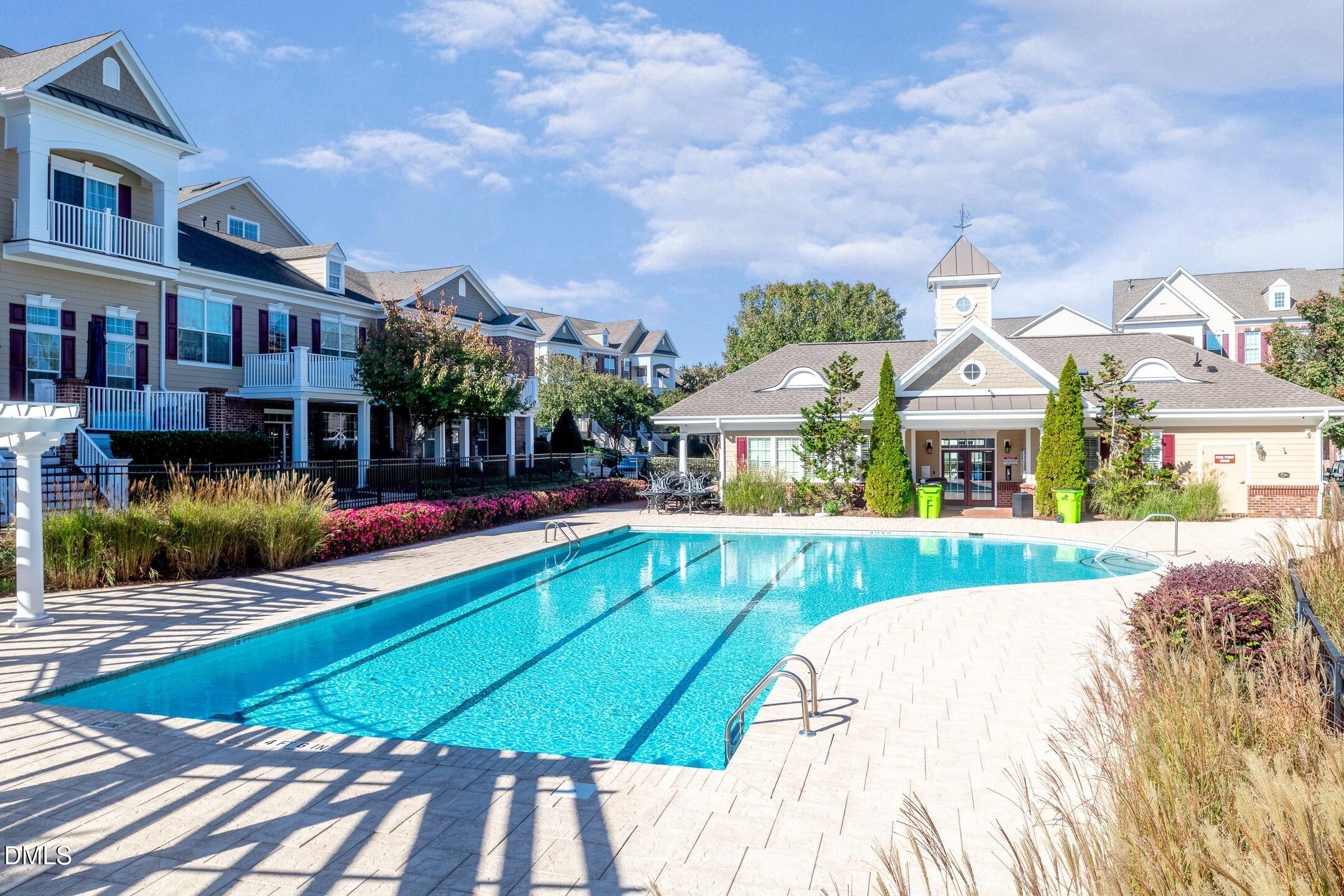 9211 Calabria Drive, Unit 104 Raleigh, NC 27617 - Photo 44 of 45 a view of a house with a yard and sitting area