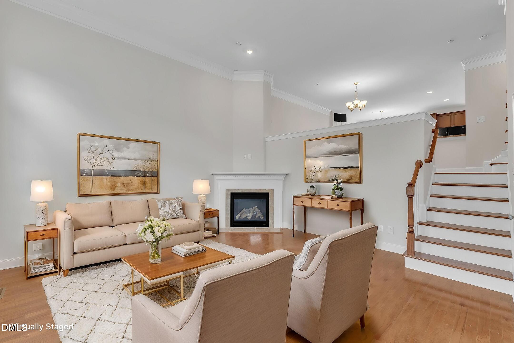 9211 Calabria Drive, Unit 104 Raleigh, NC 27617 - Photo 6 of 45 a living room with furniture and a fireplace