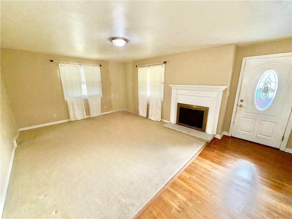 35 Cramer Avenue Uniontown, PA 15401 - Photo 10 of 21 a view of empty room with window and fireplace