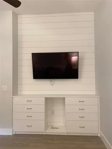 a bathroom with a fireplace and a cabinet