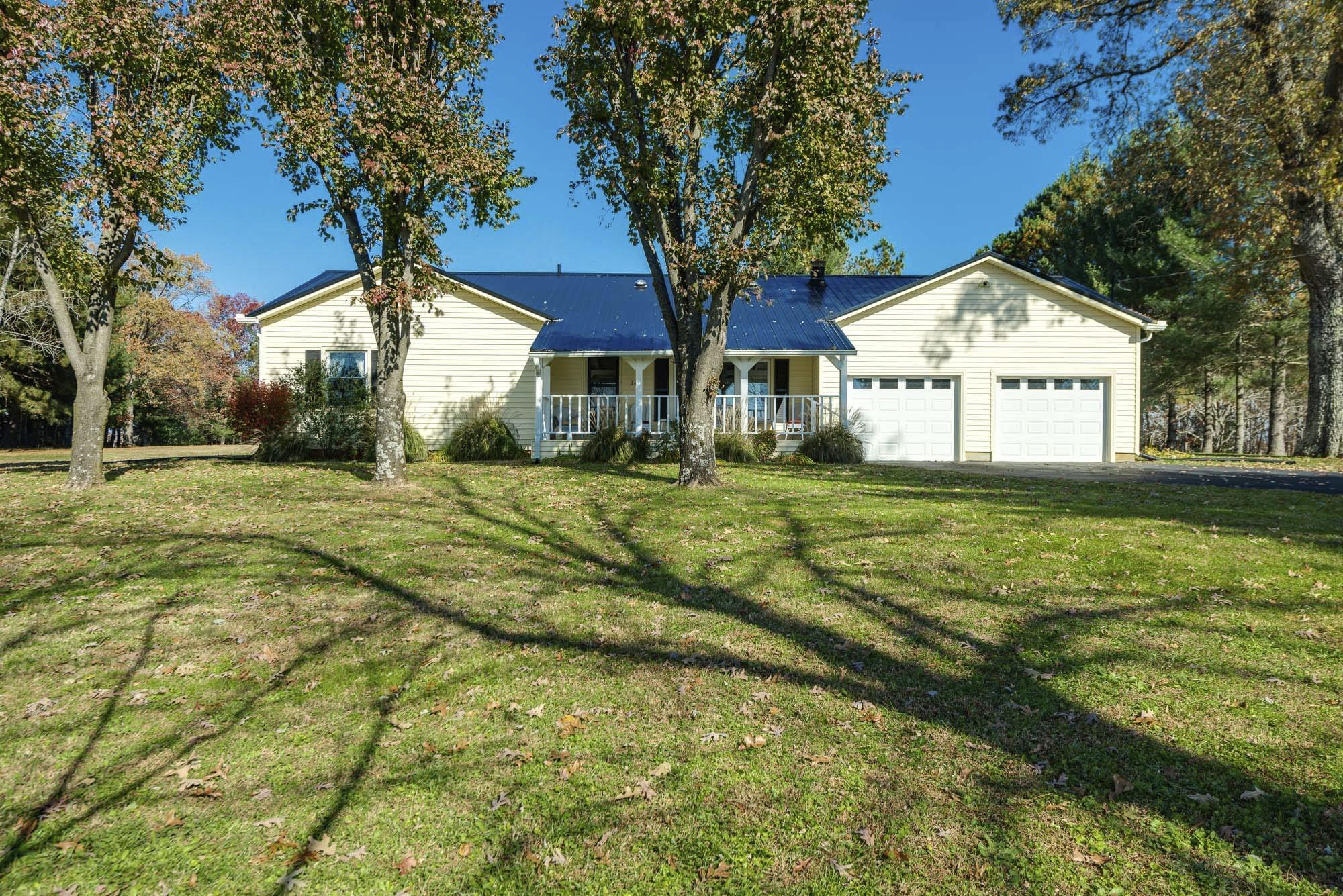 7451 Martin Road Baxter, TN 38544 - Photo 1 of 29 a front view of a house with a yard