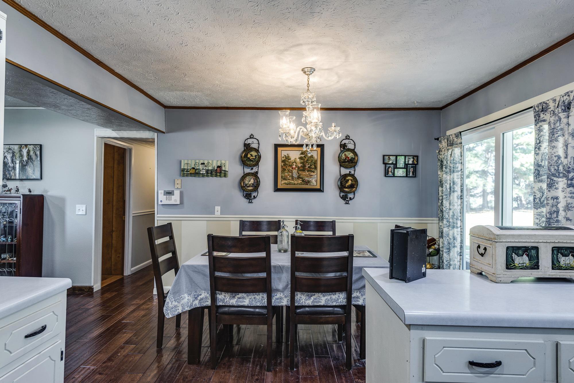 7451 Martin Road Baxter, TN 38544 - Photo 14 of 29 a view of a dining room with furniture window and wooden floor