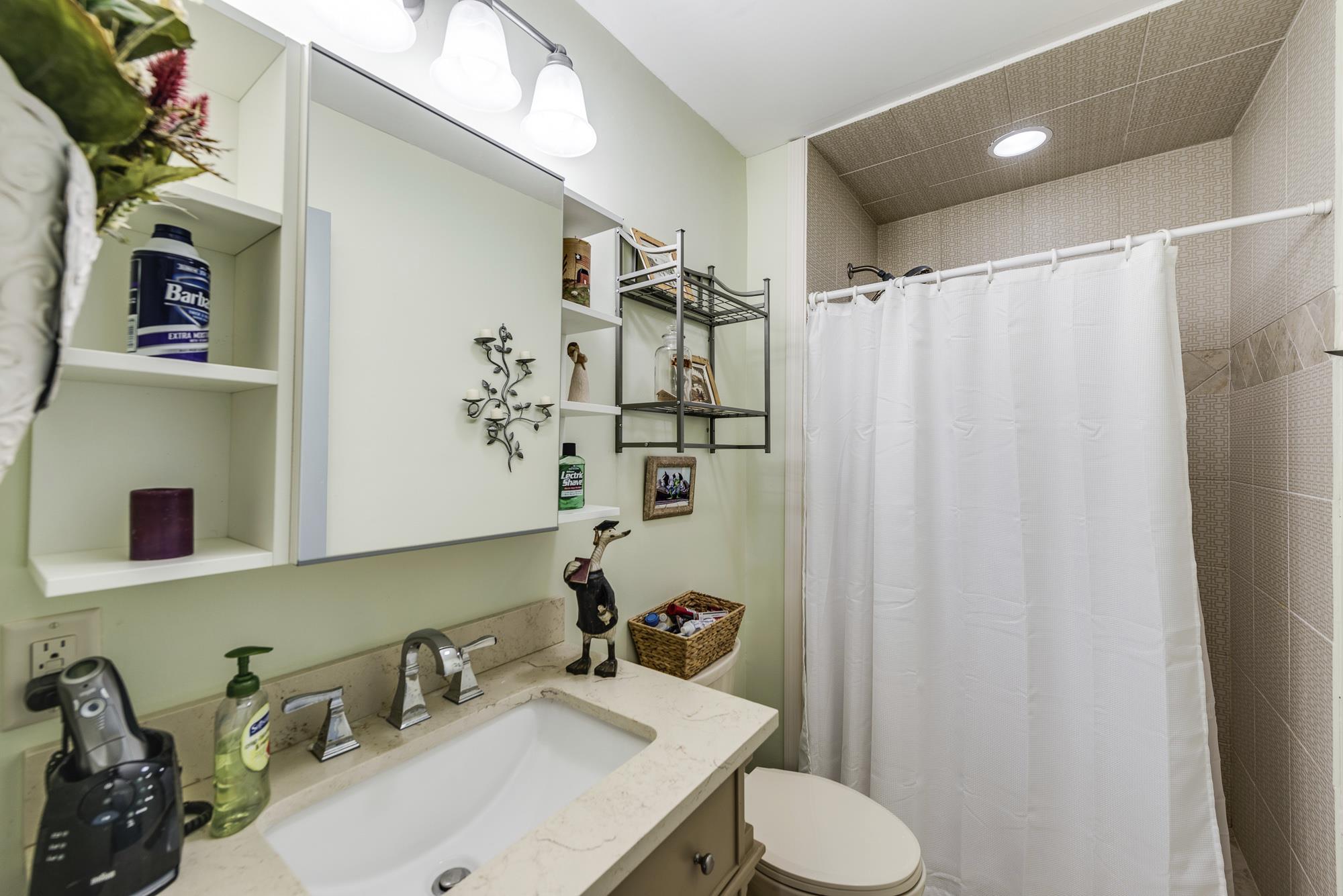 7451 Martin Road Baxter, TN 38544 - Photo 17 of 29 a bathroom with a sink toilet and shower