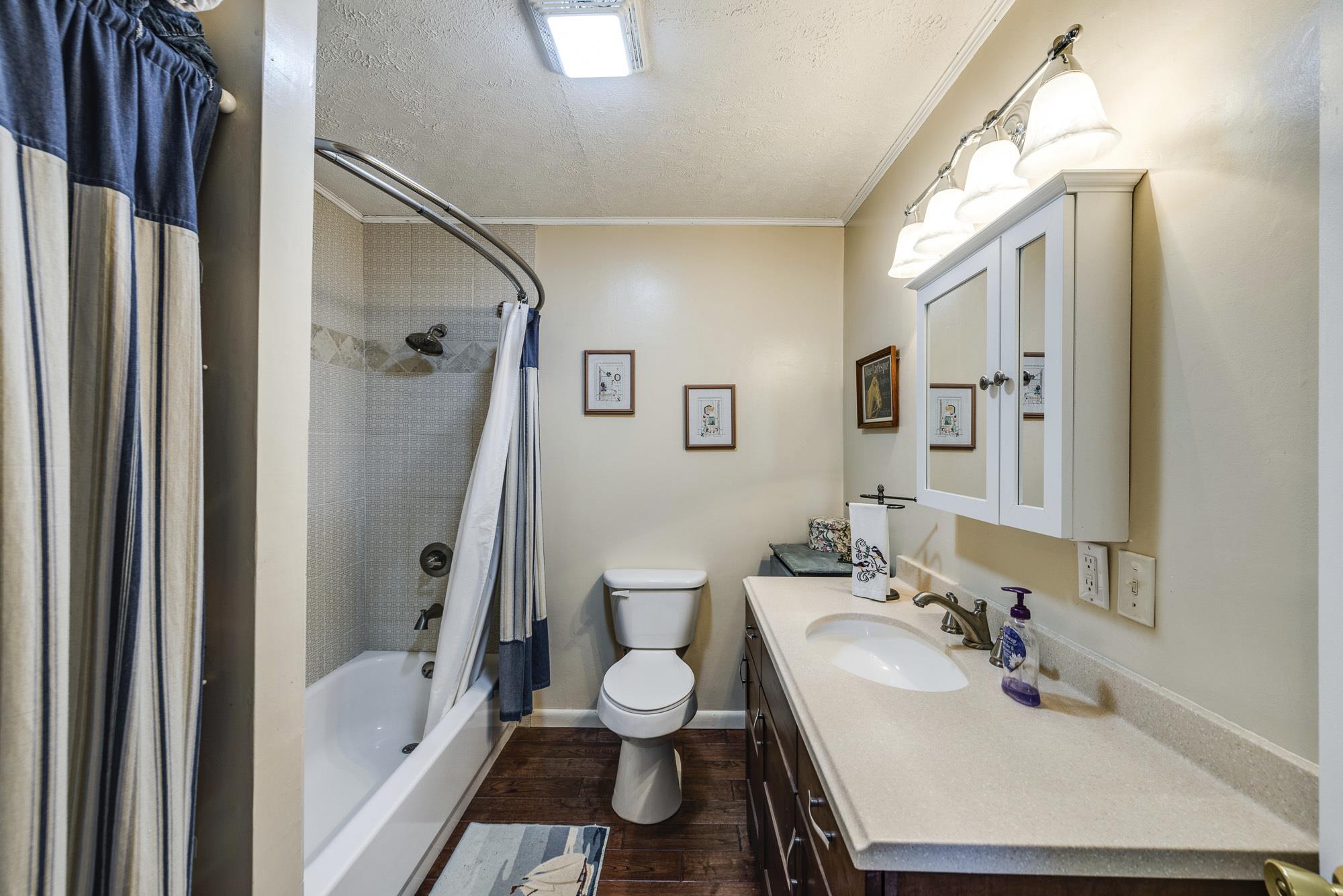 7451 Martin Road Baxter, TN 38544 - Photo 18 of 29 a bathroom with a sink toilet tub and shower