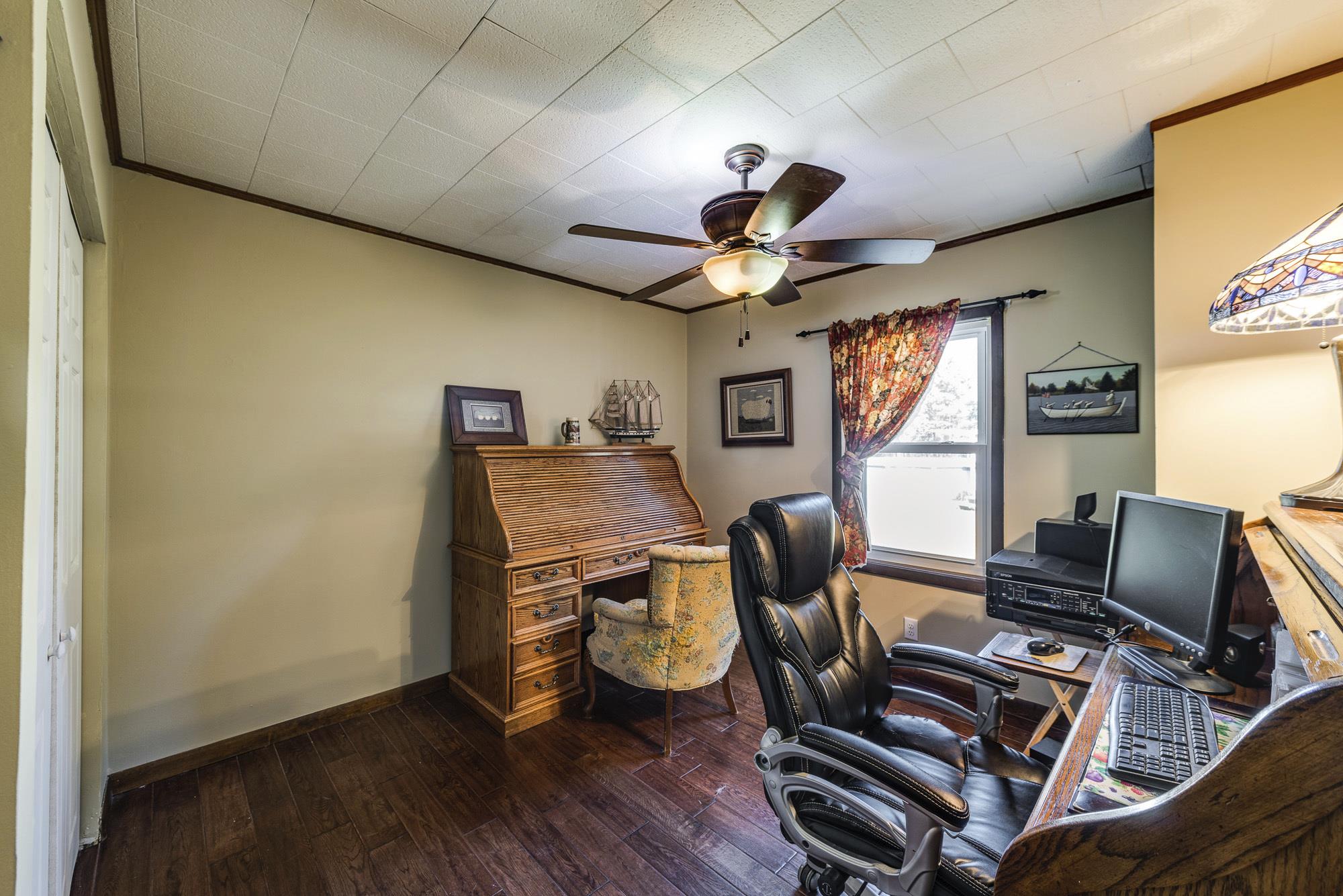 7451 Martin Road Baxter, TN 38544 - Photo 19 of 29 a view of a workspace with furniture and a window