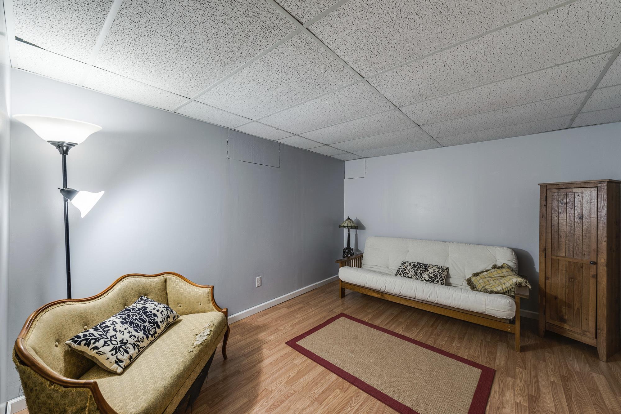 7451 Martin Road Baxter, TN 38544 - Photo 22 of 29 a bedroom with a bed and wooden floor